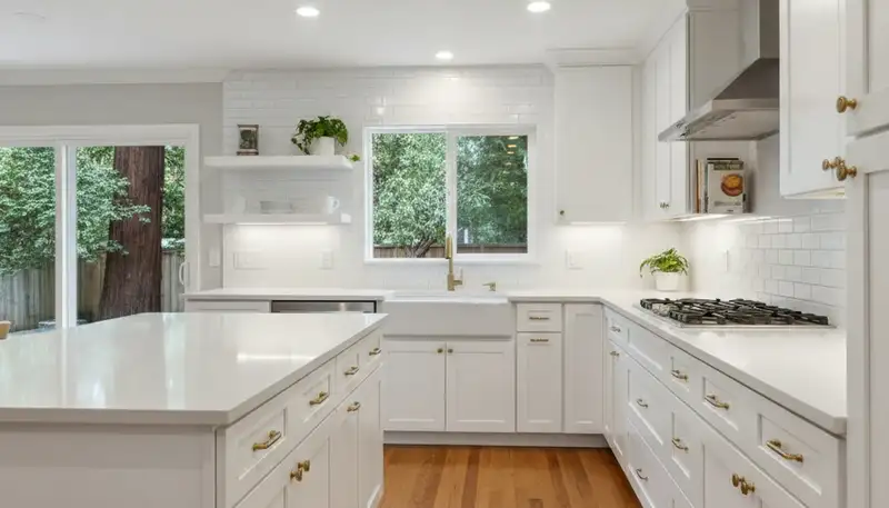 Refinished kitchen cabinets in Oakland, CA with smooth, modern paint finish by local painting contractors