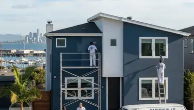 Professional house painters working on exterior home repainting in Oakland, CA