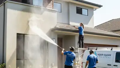 Professional pressure washing on Oakland, CA home exterior removing mildew and grime for fresh paint prep